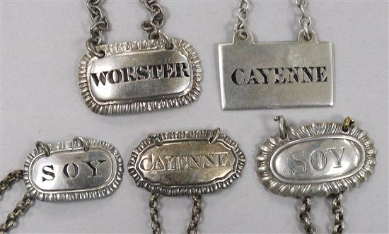 Five George III and later silver sauce labels;